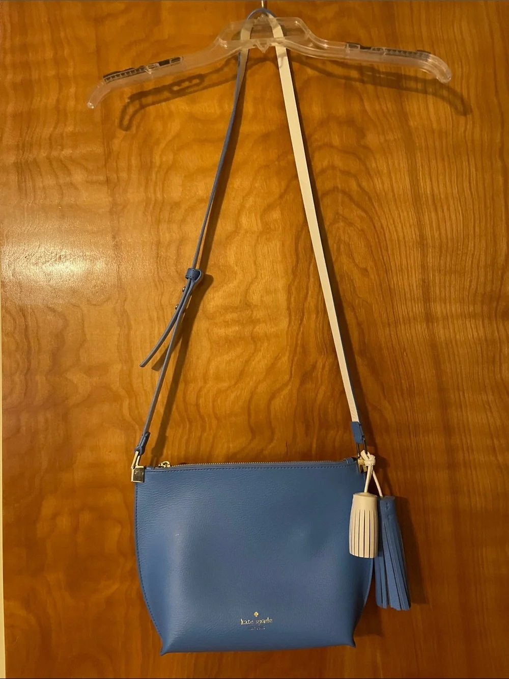 kate spade blue crossbody with cream strap and tassel